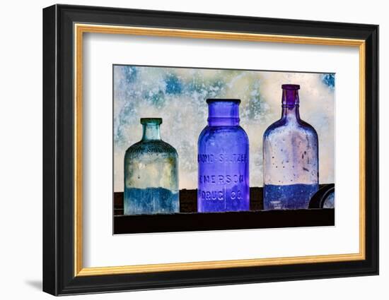 Antique colored bottles in window, Prescott National Forest, Jerome, Arizona-Adam Jones-Framed Photographic Print