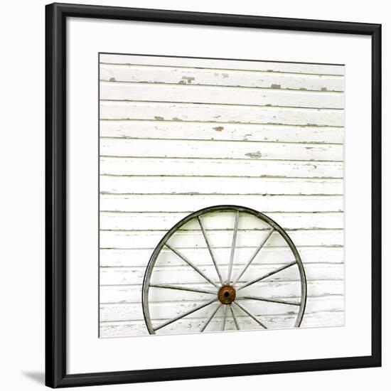 Antique Wooden Wagon Wheel on Rustic White Background-Christin Lola-Framed Photographic Print