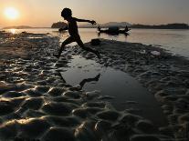 A Boy Plays on the Banks of the River Brahmaputra in Gauhati, India, Friday, October 27, 2006-Anupam Nath-Framed Photographic Print