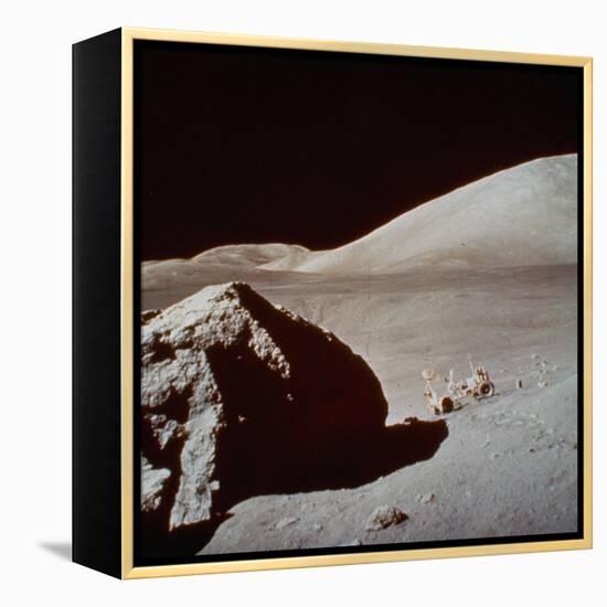 Apollo 17's Rover, a Lunar Vehicle, on the Surface of the Moon Next to Giant Rock-null-Framed Premier Image Canvas