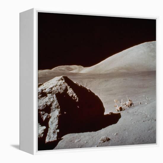 Apollo 17's Rover, a Lunar Vehicle, on the Surface of the Moon Next to Giant Rock-null-Framed Premier Image Canvas