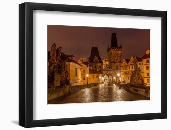 Arch of Lesser Town Bridge Tower on Charles Bridge with St. Nicholas Church in Prague.-Chuck Haney-Framed Photographic Print