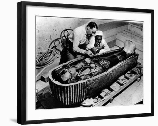 Archaeologist Howard Carter Examining Coffin of Tutankhamen, with 14th Century Egyptian Pharaoh-null-Framed Premium Photographic Print