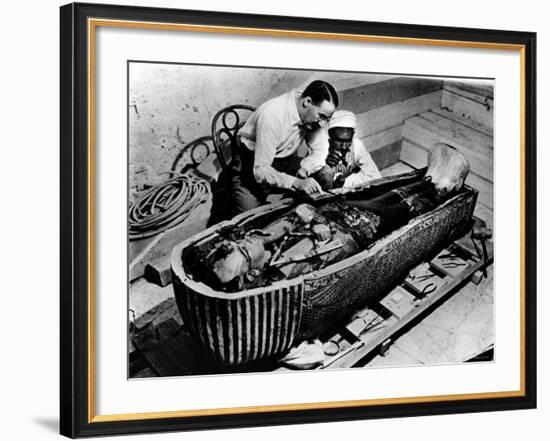Archaeologist Howard Carter Examining Coffin of Tutankhamen, with 14th Century Egyptian Pharaoh-null-Framed Premium Photographic Print
