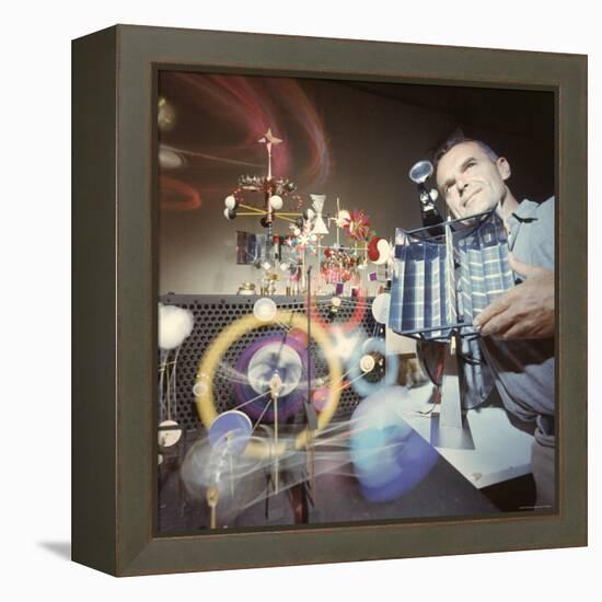 Architect/Designer Charles Eames with Engine that Generates Solar Power to Run Toys Surrounding Him-Ralph Crane-Framed Premier Image Canvas