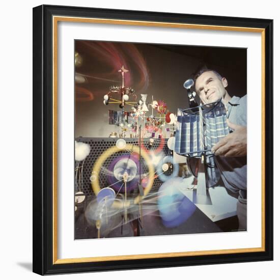 Architect/Designer Charles Eames with Engine that Generates Solar Power to Run Toys Surrounding Him-Ralph Crane-Framed Premium Photographic Print