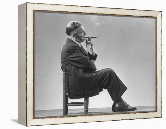 Architect Frederick Kiesler Seated in a Child's Chair, Smoking a Cigar, at Gjon Mili's Studio-Gjon Mili-Framed Premier Image Canvas