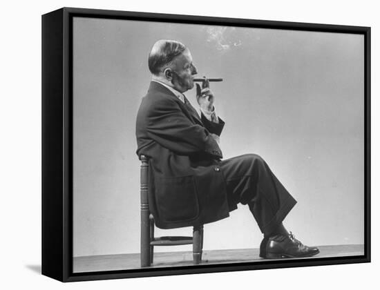 Architect Frederick Kiesler Seated in a Child's Chair, Smoking a Cigar, at Gjon Mili's Studio-Gjon Mili-Framed Premier Image Canvas