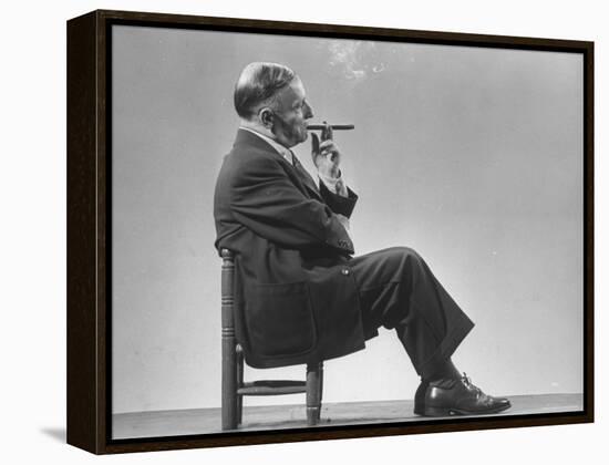 Architect Frederick Kiesler Seated in a Child's Chair, Smoking a Cigar, at Gjon Mili's Studio-Gjon Mili-Framed Premier Image Canvas