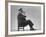 Architect Frederick Kiesler Seated in a Child's Chair, Smoking a Cigar, at Gjon Mili's Studio-Gjon Mili-Framed Premium Photographic Print