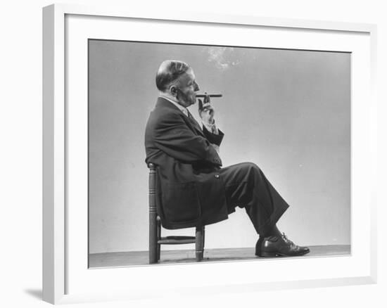 Architect Frederick Kiesler Seated in a Child's Chair, Smoking a Cigar, at Gjon Mili's Studio-Gjon Mili-Framed Premium Photographic Print