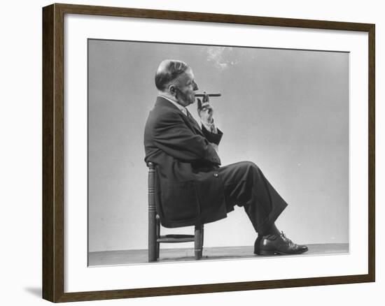 Architect Frederick Kiesler Seated in a Child's Chair, Smoking a Cigar, at Gjon Mili's Studio-Gjon Mili-Framed Premium Photographic Print