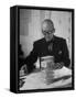 Architect Le Corbusier Studying Architectural Plans and Small Model of Building in His Office-Nina Leen-Framed Premier Image Canvas