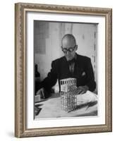Architect Le Corbusier Studying Architectural Plans and Small Model of Building in His Office-Nina Leen-Framed Premium Photographic Print