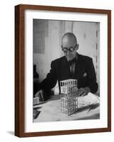 Architect Le Corbusier Studying Architectural Plans and Small Model of Building in His Office-Nina Leen-Framed Premium Photographic Print