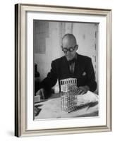 Architect Le Corbusier Studying Architectural Plans and Small Model of Building in His Office-Nina Leen-Framed Premium Photographic Print