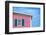 Architecture Detail of a Pink House with Blue Shuttered Window against Blue Sky-pink candy-Framed Photographic Print