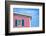 Architecture Detail of a Pink House with Blue Shuttered Window against Blue Sky-pink candy-Framed Photographic Print