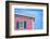 Architecture Detail of a Pink House with Blue Shuttered Window against Blue Sky-pink candy-Framed Photographic Print