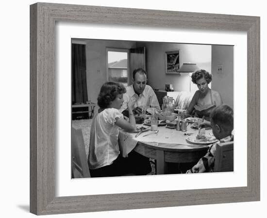 Arizona Family Seated at their Dining Room Table, Enjoying their Dinner-Nina Leen-Framed Photographic Print
