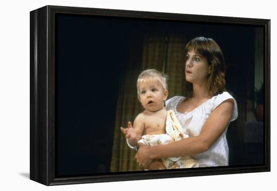 Arizona Junior RAISING ARIZONA by Joel Coen and Ethan Coen with Holly Hunter, 1987 (photo)-null-Framed Stretched Canvas