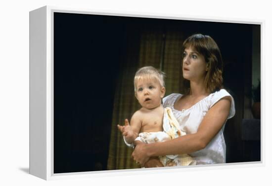 Arizona Junior RAISING ARIZONA by Joel Coen and Ethan Coen with Holly Hunter, 1987 (photo)-null-Framed Stretched Canvas
