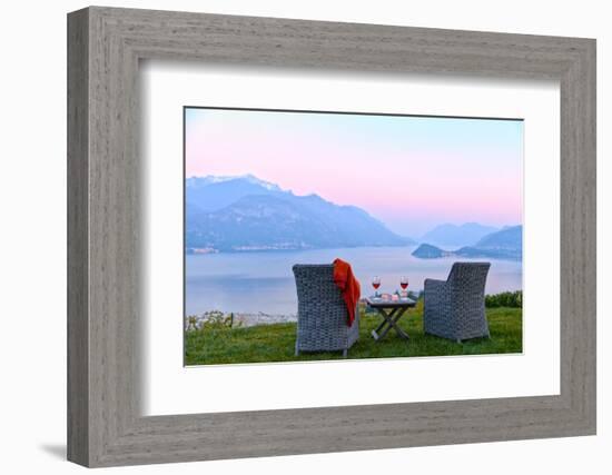 Armchairs and red wine with views of Lake Como at sunset, Lombardy, Italian Lakes, Italy-Simon Montgomery-Framed Photographic Print