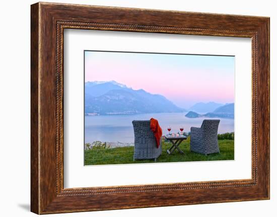 Armchairs and red wine with views of Lake Como at sunset, Lombardy, Italian Lakes, Italy-Simon Montgomery-Framed Photographic Print