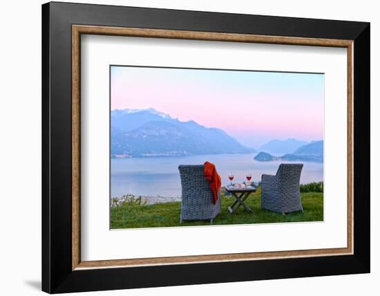 Armchairs and red wine with views of Lake Como at sunset, Lombardy, Italian Lakes, Italy-Simon Montgomery-Framed Photographic Print