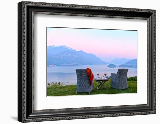 Armchairs and red wine with views of Lake Como at sunset, Lombardy, Italian Lakes, Italy-Simon Montgomery-Framed Photographic Print