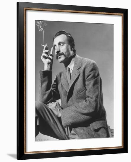 Armenian Artist Arshile Gorky Holding a Cigarette-Gjon Mili-Framed Premium Photographic Print