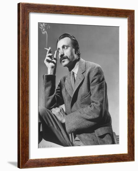 Armenian Artist Arshile Gorky Holding a Cigarette-Gjon Mili-Framed Premium Photographic Print