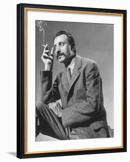 Armenian Artist Arshile Gorky Holding a Cigarette-Gjon Mili-Framed Premium Photographic Print