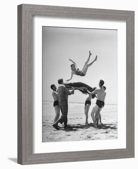 Army Men Bouncing Starlet Majorie Woodworth Into the Air-John Florea-Framed Photographic Print