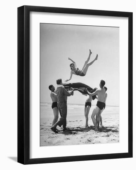 Army Men Bouncing Starlet Majorie Woodworth Into the Air-John Florea-Framed Photographic Print