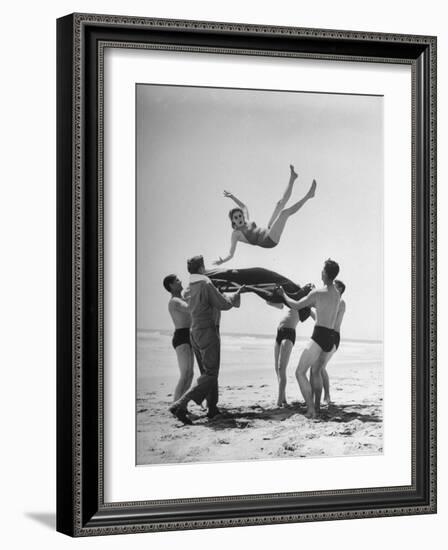 Army Men Bouncing Starlet Majorie Woodworth Into the Air-John Florea-Framed Photographic Print