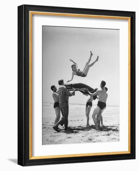 Army Men Bouncing Starlet Majorie Woodworth Into the Air-John Florea-Framed Photographic Print