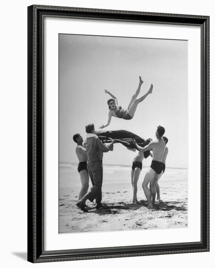 Army Men Bouncing Starlet Majorie Woodworth Into the Air-John Florea-Framed Photographic Print