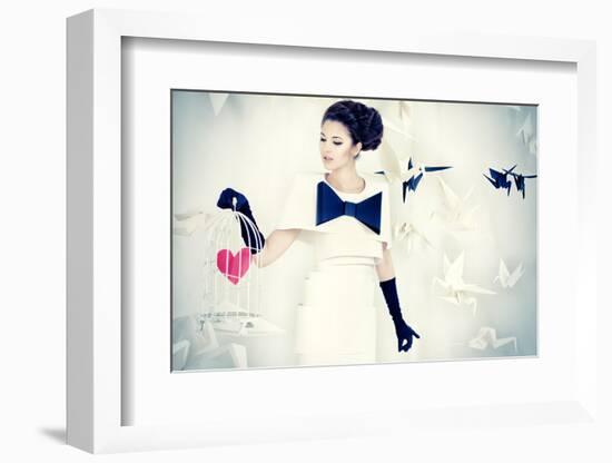 Art Fashion Photo of a Gorgeous Woman in Paper Dress Holding Birdcage with Red Heart. Black and Whi-prometeus-Framed Photographic Print