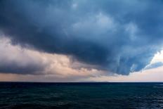 Mysterious Silhouette of Corfu Island over the Horizon with Navy Blue Sea Waves under the Dramatic-Artem Avetisyan-Photographic Print
