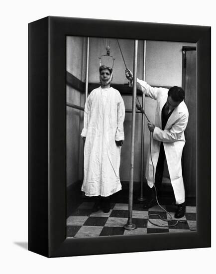 Arthritis Patient Being Treated with Stretching Device at Clinic-Alfred Eisenstaedt-Framed Premier Image Canvas