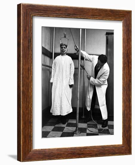 Arthritis Patient Being Treated with Stretching Device at Clinic-Alfred Eisenstaedt-Framed Photographic Print