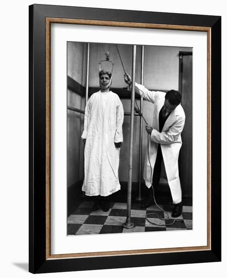 Arthritis Patient Being Treated with Stretching Device at Clinic-Alfred Eisenstaedt-Framed Photographic Print