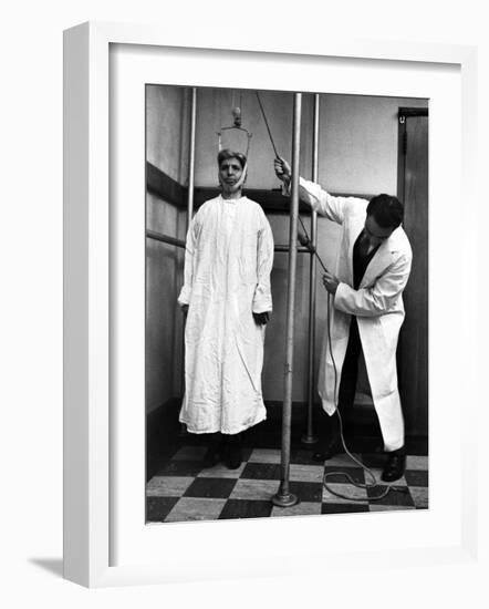 Arthritis Patient Being Treated with Stretching Device at Clinic-Alfred Eisenstaedt-Framed Photographic Print