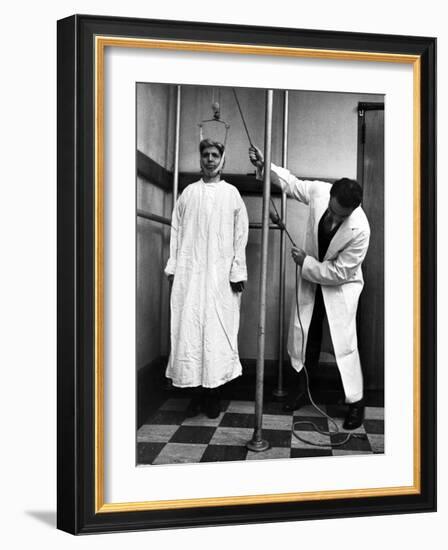 Arthritis Patient Being Treated with Stretching Device at Clinic-Alfred Eisenstaedt-Framed Photographic Print