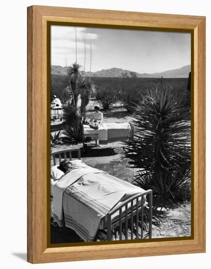 Arthritis Patients Being Tended to by Nurses as They Undergo Sunbathing Treatment at Desert Clinic-Alfred Eisenstaedt-Framed Premier Image Canvas