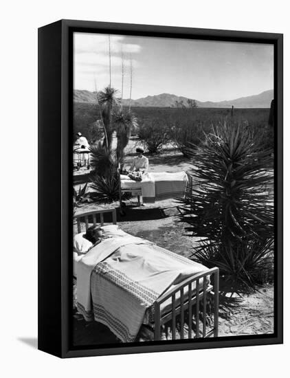 Arthritis Patients Being Tended to by Nurses as They Undergo Sunbathing Treatment at Desert Clinic-Alfred Eisenstaedt-Framed Premier Image Canvas