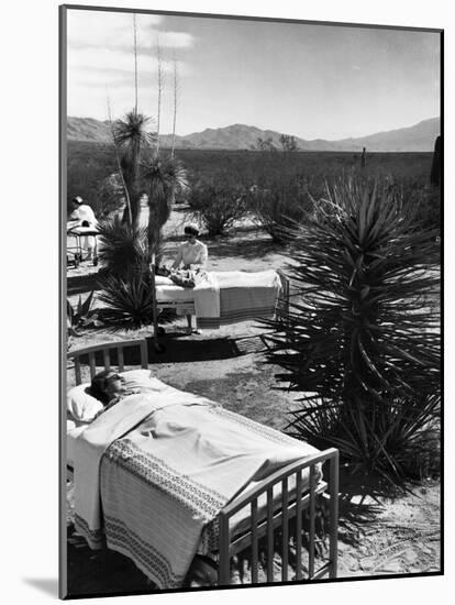 Arthritis Patients Being Tended to by Nurses as They Undergo Sunbathing Treatment at Desert Clinic-Alfred Eisenstaedt-Mounted Photographic Print
