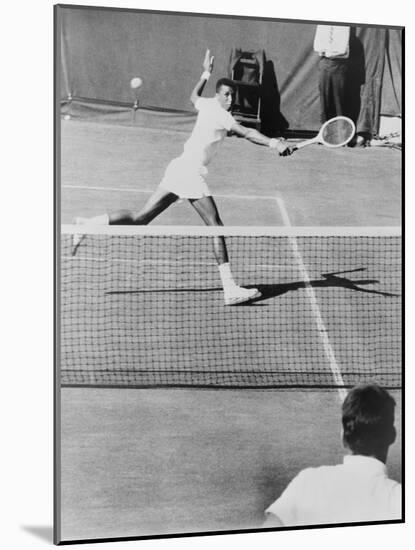Arthur Ashe, Playing Tennis at Forest Hills, N.Y. in 1964-null-Mounted Photo