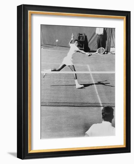 Arthur Ashe, Playing Tennis at Forest Hills, N.Y. in 1964-null-Framed Photo